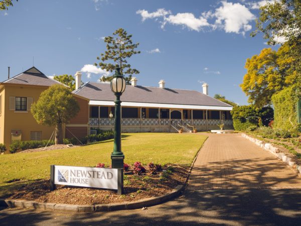 Newstead House exterior shot of driveway and entry sign
